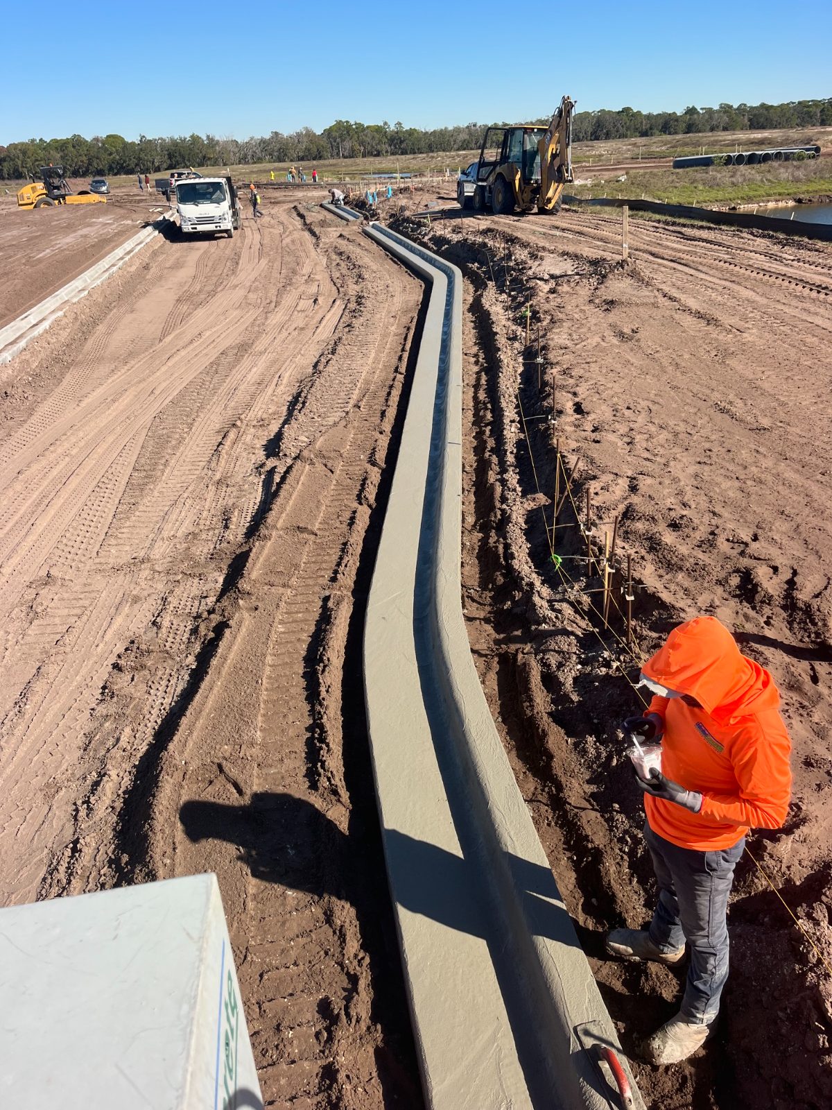 Slip-formed machine curb winding through a new residential development