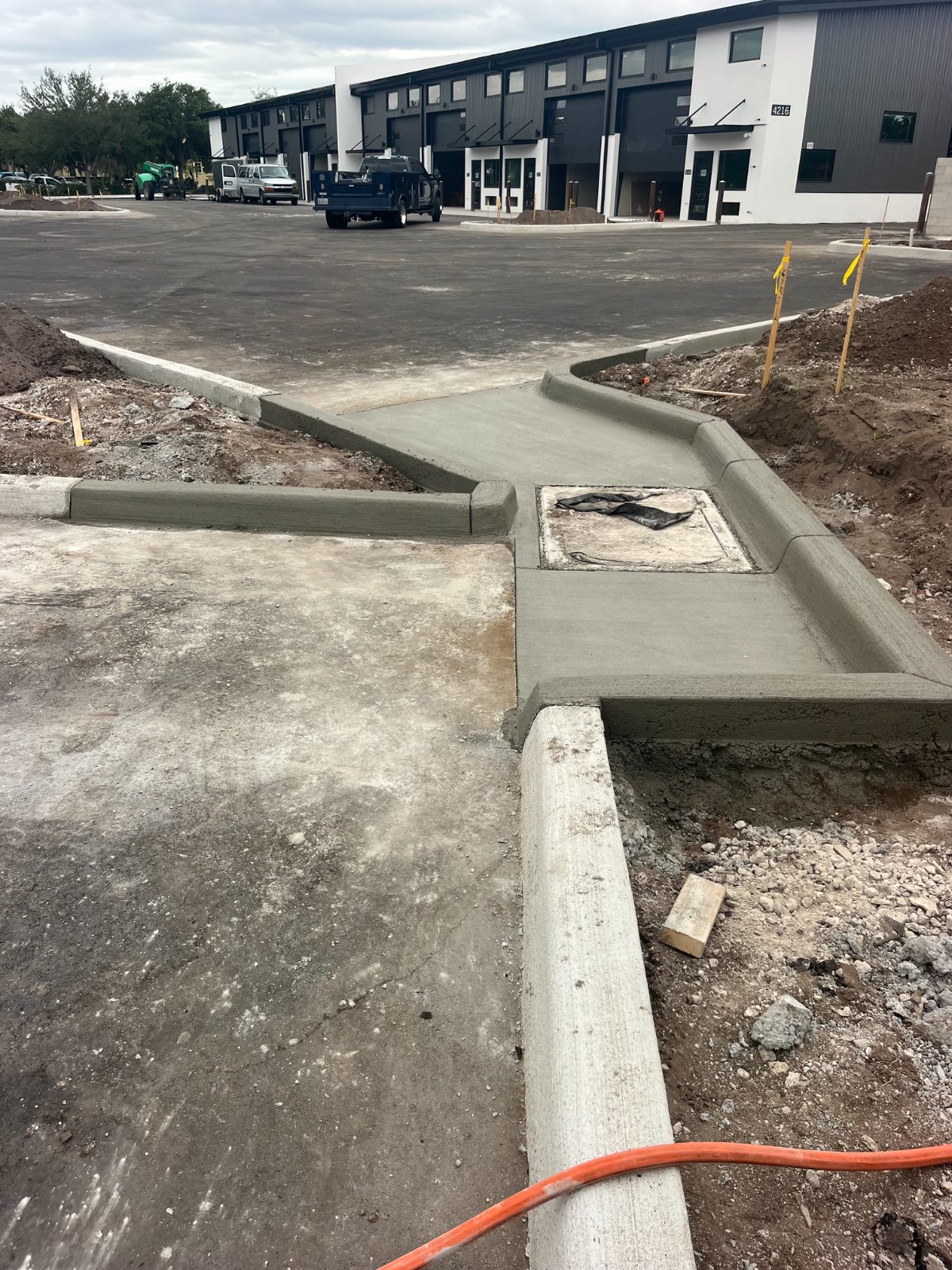 Hand-formed concrete curb and gutter at a commercial project